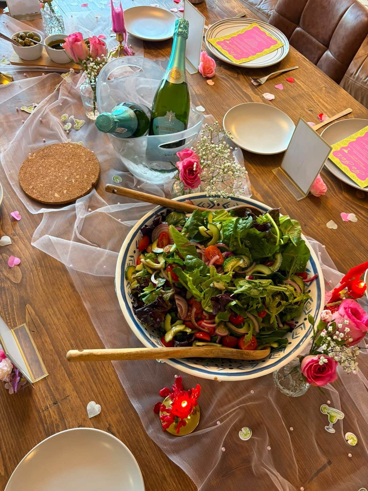 A private dining table laid with colourful sharing dishes